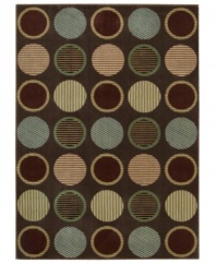 Design that's spot on. This marvelously modern area rug bursts forth from your floor with row upon row of textured circles, presented in appealing colors on a deep chocolate ground, and hand-carved to add that extra, eye-catching dimension.