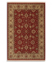 This Karastan rug takes classic elements from the Orient and updates them in an American palette, featuring a lush vine and palmette border pattern against a vivid red ground. Made from 100% premium worsted 3-ply wool for a soft hand and long-lasting wear.