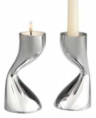 Light tapers or tea lights in this sensually sculpted pair of metal candlesticks. A mirrored finish reflects the flames, adding drama to a darkened room. Designed by acclaimed sculptor and interior and furniture designer Karim Rashid, Flow candlesticks continue the Nambé tradition of functional art.
