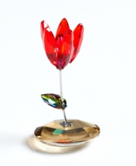 This cherry-red tulip rocks in the breeze, rooted in a faceted crystal disc. A multicolored leaf sprouts from a simple, silvertone stem. From Swarovski.