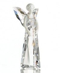 A perfect harmony of fine porcelain and exquisite crystal, the Alina angel figurine from Swarovski accents holiday homes with ethereal beauty.