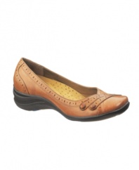 Slip on stylish comfort. The Burlesque flats by Hush Puppies provide support for all day wear while the the eyelet detailing makes them a polished choice for the office.
