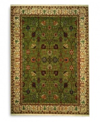Inspired by 18th-century Persian tapestries, this rug features a vinery trellis motif in a lush palette of color that includes spice reds, soft blues and warm browns. A distinctive border of flowering shrubs and cypresses perfectly frames the rich color shadings of the sage green ground. Each color is individually skein-dyed for jewel-tone clarity and stunning depth. A patented luster wash imparts a vintage finish faithful to the craftsmanship of the original.