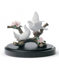 Find peace in the graceful doves and pink blooms of this Lladro collectible. A serene nature scene, handcrafted in glazed porcelain.