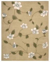 Floral appeal. Gracefully designed with delicate blossoms against a light gold ground, this area rug is hand tufted and hand carved from only the finest premium wool, then expertly washed to lend the surface a handsome luster, texture and sheen.