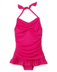 A ruffle skirt and shirring add a sweet touch to this halter swimsuit from Juicy Couture.