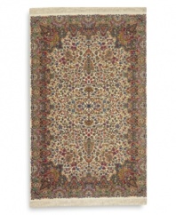 Deeply colorful and elaborately designed, this 30-color Kirman rug is inspired by the intense hues and exceptional intricacies of hand-knotted rugs of ancient Persia. Each color is individually skein-dyed for jewel-tone clarity. A patented wash process creates a vintage finish faithful to the craftsmanship of the original. Woven in the USA of premium fully worsted New Zealand wool.