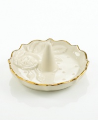 A single rose blossom and delicate dots carved in ivory porcelain make this classic ring holder a fine storage space for special jewelry. With a scalloped, gold-tipped rim. Qualifies for Rebate