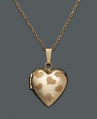 The perfect place to store precious memories. This tiny, children's heart locket necklace is crafted in 14k gold and features engraved hearts on the surface. Approximate length: 15 inches. Approximate drop: 1/2 inch.
