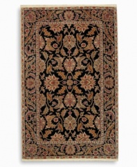 Inspired by an early 20th-century carpet woven in Turkey, the Oushak pattern of this Agra rug features an exotic palmette motif and rosette border in earth tones against a dramatic black background. Subtle gradations of color evoke the timeworn striated effect created by aged vegetable dyes. A special antique wash further harmonizes the colors into a rich vintage finish. Woven in the USA of luxuriously soft premium worsted New Zealand wool.