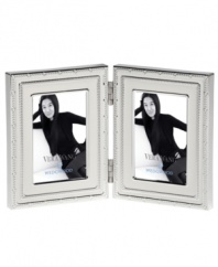 Add new elegance to beautiful memories with Vera Wang's With Love Blanc folding picture frame. Geometric detail lends metallic shimmer to creamy white enamel in a home accent that invokes modern and deco design.