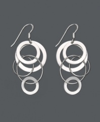Let chic circles orbit your earlobes. These funky asymmetrical earrings feature interlocking circles set in sterling silver. Approximate drop: 2 inches.