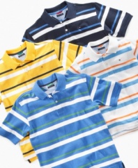 Sporty stripes on this polo shirt from Tommy Hilfiger keep him comfortable and stylish whether he's in school or out and about.