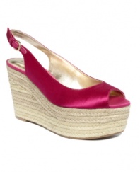 Bold and beachy come together perfectly on the Rueman wedges by GUESS. A slingback silhouette in satin sits atop an espadrille wedge for a style that goes from day to night.
