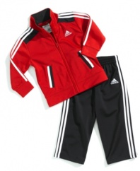 Sporty style starts early when he's wearing this comfortable tricot jacket and pant set from adidas.