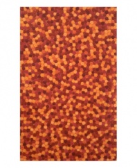 There's no denying that this rug is hot. Ablaze with hundreds of dazzling red and orange pompom shapes, this one-of-a-kind rug brings a burst of color and texture to otherwise plain floors. Constructed of plush, dense wool, you'll be treated to a rug with a luxurious softness and adventurous design you won't find anywhere else.