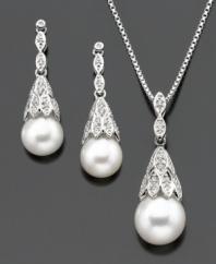 Luminous cultured freshwater pearl (7.5-9 mm) emerges from sparkling diamond-accented settings on this beautiful sterling silver jewelry set. Pendant measures approximately 18 inches with a 1-inch drop. Earrings measure approximately 1 inch.