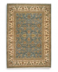 Inspired by an early 20th century Sultanabad design, this rug features a graceful floral motif against a soft blue background that recalls the tranquil night sky. Individual skein-dyeing enhances the rich tones of a palette that includes rose quartz, peridot, amber, citrine, amethyst and topaz. A patented luster wash creates a vintage finish faithful to the craftsmanship of the original. Woven in the USA of premium fully worsted New Zealand wool.