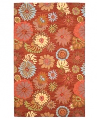 Playful posies. The Blossoms area rug presents ultra-modern florals scattered across a warm red ground. Woven meticulously in India of soft, long wool fibers, its intricate composition is as attractive as it is durable.