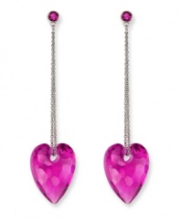 Embrace your playful, romantic side. Swarovski's drop-shaped earrings feature a beautiful, puffed heart silhouette on a stainless steel chain. Created in Fuchsia crystal in an exclusive cut. Approximate drop: 2-1/4 inches.