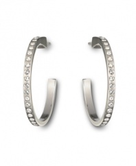 Keep your options open with Swarovski's open hoop crystal earrings. Whether you choose to wear them for daytime or evening, their subtle sparkle will make a stunning impact. Crafted in silver tone mixed metal. Approximate diameter: 2 inches.