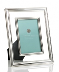 Your fondest memories are crystal-clear in this contemporary picture frame from Martha Stewart Collection. Silver-plated rims define luminous glass, accenting any room with flawless grace.