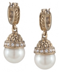 A traditional and timeless piece, Carolee's hoop earrings offer an extra hint of shimmer with white glass pearls and sparkling glass accents. Set in antique gold-plated mixed metal. Approximate drop: 1-1/2 inches.