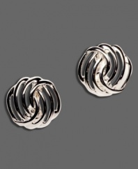 Admirable accents for everyone! Highlight your look with these stylish silver tone mixed metal clip on earrings by Monet.