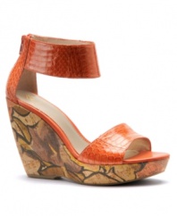 Get that tropical island flair with Isola's Oasis wedge sandals. The stunning, sky-high wedge heel partners beautifully with the snake print upper.
