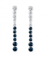 Revel in utter elegance. Swarovski's Hot Montana drop earrings feature icy round-cut clear and Montana blue crystals in a silver tone mixed metal setting. Approximate drop: 3 inches.