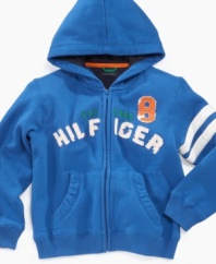 Keep his team spirit active in this athletically styled Tommy Hilfiger hoodie.