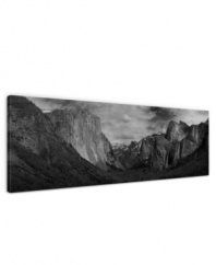 Looming larger than life in black and white, the Sierra Nevada mountains define the awe-inspiring landscape of Yosemite Valley in this impressive gallery-wrap canvas print. A room-defining piece by artist Ashley Beck.