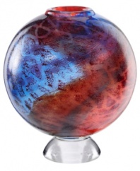 An expression of Africa's rich savannah, the Zanzibar vase unites bright fiery reds and cool sky blues in an abstract maze of color and texture. Its globular shape, crafted in heavy art glass, is a tribute to Earth. By Scandinavian artist Kjell Engman.