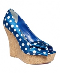 Trends collide on the Shelly design by Paris Hilton. Polka-dot-printed satin, a wedge silhouette and plenty of cork are a winning combo.