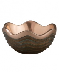 Featuring a bold new look for Nambe's signature metal, the Copper Canyon bowl captures the striking beauty of the American Southwest in brilliant copper. A rippled shape inspired by the region's wind- and water-worn canyons is finished with a rustic green patina.