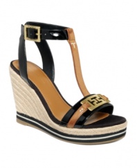 Elongate your legs with these fetching Daisie espadrille wedges by Tommy Hilfiger. With gold tone hardware details and a chic t-strap, polished toes have never looked so perfect.