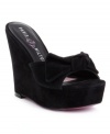 Luxe suede and a pretty decorative bow team up to make the Stephanie wedge sandals by Paris Hilton an instant favorite.