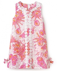 This lace-trimmed shift dress from Lilly Pulitzer updates a classic look with a bold print pattern and bow accents at the hem.