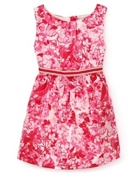 A sleeveless vision of delicate plum-colored flowers spring forth from this floral print dress by Juicy Couture.