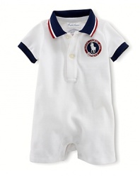 A preppy short-sleeved polo shortall in breathable stretch cotton mesh is accented with USA patching, celebrating Team USA's participation in the 2012 Olympics.