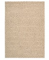 A blizzard of soft spots linger in between imperfect lines, creating beautiful harmony against a gentle sand-hued ground. Hand tufted from 100% natural wool, this plush Calvin Klein rug is crafted using the cut-and-loop pile technique that creates a unique matte surface texture.