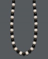 Show your true stripes with stylish, contrasting colors. Necklace features a chic strand of bold onyx beads (85 ct. t.w.) and cultured freshwater pearls (8-9 mm). Clasp crafted in 14k gold. Approximate length: 18 inches.