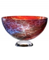 An expression of Africa's rich savannah, the Zanzibar bowl unites bright fiery reds and cool sky blues in an abstract maze of color and texture. Its globular shape, crafted in heavy art glass, is a tribute to Earth. By Scandinavian artist Kjell Engman.