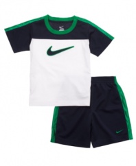 Stay active. Get him moving with this comfortable, sporty t-shirt and short set from Nike.