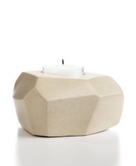 Set the mood in stone. Chiseled and sanded by hand, no two candle holders are exactly alike but each is beautifully crafted in Haitian soapstone. A modern shape and organic feel make it a unique home accent – and a great gift!