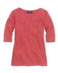 A soft ribbed cotton jersey top is updated with lace trim and a ribbon accent at the neckline.