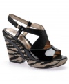 The wildest wedge. With a zebra-print canvas-wrapped platform wedge and sexy patent leather straps, the Oceola sandals by Sofft are a force to be reckoned with.