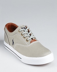 The classic preppy low-top rendered in canvas with leather lining and trim.
