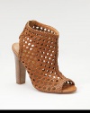 With the rich look of rattan, this striking sandal boot of woven leather has an open toe and back, plus an elastic inset for slip-into ease.Stacked heel, 4½ (115mm) Shaft, 2 Leg circumference, 11 Back elastic inset Leather lining and sole Padded insole ImportedOUR FIT MODEL RECOMMENDS ordering true size. 
