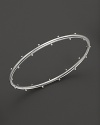 Sterling silver buds blossom on this Elizabeth Showers bangle.